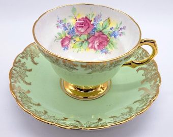 Vintage Rosina teacup and saucer , florals with gold filigree, made in England
