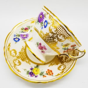 Hammersley Old Meissen teacup and saucer with gold accents, floral bouquet