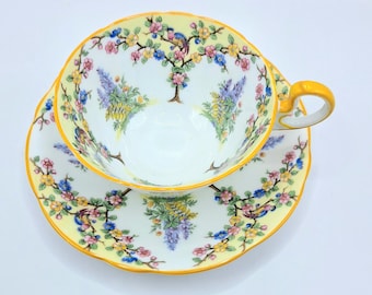 Aynsley  teacup and saucer with birds and flowers, made in England