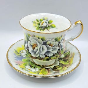 Beautiful Paragon Marlborough teacup and saucer with white flowers ,bone china ,made in England