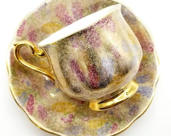 Royal albert heavy gold teacup and saucer, red, blue yellow flowers, bone china made in England