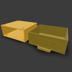 May include: A yellow plastic storage drawer unit consisting of an outer frame and a removable drawer. The drawer front features a small handle, diagonal textured lines on the side, and the word TOOLS embossed in the center of the front panel.
