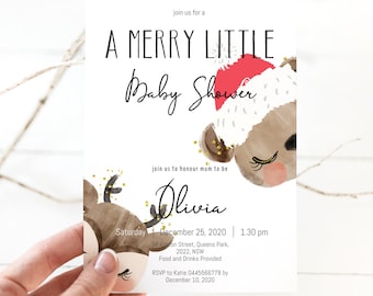 May include: A white baby shower invitation with a reindeer design wearing a Santa hat. The invitation reads "A Merry Little Baby Shower" and includes event details such as the date, time, and location. The words "Digital Template" are at the bottom.