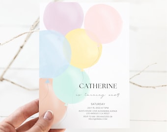 May include: A white invitation card featuring watercolor-style balloons in pastel pink, lavender, yellow, blue, mint, and peach. The text reads: CATHERINE is turning one, SATURDAY, JULY 16, 2022 AT 5PM, ALEX'S HOUSE | 2341 ALEXANDRIA AVENUE, LOS ANGELES | CA 90027, RSVP TO MIA 818.444.5255 OR HELLO@GMAIL.COM.