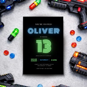 May include: Black invitation card with neon blue and green text, announcing a 13th birthday party for Oliver. The card is surrounded by toy guns and colorful toy bullets. The invitation includes the date, time, and location.