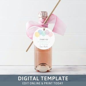 May include: A round, white tag with a watercolor illustration of pastel-colored balloons. The tag has the text "THANK YOU for Celebrating my 1st Birthday! Love, Charlie".