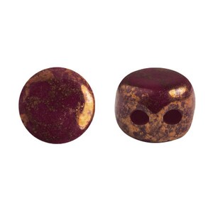 May include: Two round ceramic beads with a burgundy color and gold flecks. One bead is solid and the other has two holes.