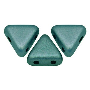 May include: Three teal green triangle-shaped beads with three holes each.