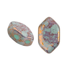 May include: Two gemstone beads with a unique shape and color pattern. The beads have a mix of colors, including teal, purple, and gold. One bead has two holes. The beads are likely used for jewelry making.
