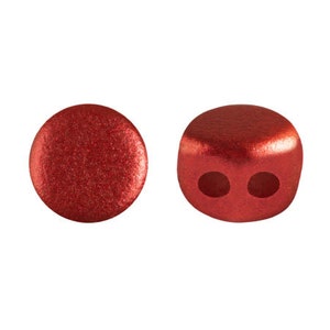 May include: Two red metallic beads with two holes each. The beads are round and have a shiny finish.