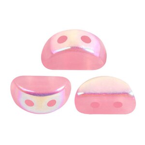 May include: Three pink iridescent glass beads with two holes each. The beads are half-round and have a shiny, pearlescent finish.