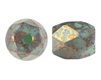 May include: Two faceted glass beads with a green and gold metallic finish. The beads have a rustic, aged look.