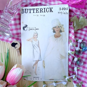 May include: A vintage Butterick sewing pattern, size 16, featuring illustrations of a woman in a dress and suit. The pattern number is 3494. The cover has the text "Jane & Jane" and "Bust 36". The background is a pink and white checkered pattern.