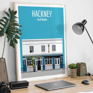 May include: A blue and white illustration of a pub called "Royal Sovereign" in Hackney, East London. The pub has a blue door and windows, and a white sign with the pub's name in gold letters.