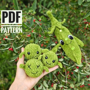 May include: PDF pattern for crocheting green pea pod and pea plush toys. The pea pod is standing upright and the peas are in a hand. The peas have cute faces with black eyes and smiling mouths.