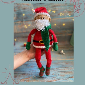May include: Crochet pattern for a Santa Claus doll. The doll is wearing a red suit with a white trim, a green scarf, and a white beard. The doll is holding a green bag in one hand and a red mitten in the other.