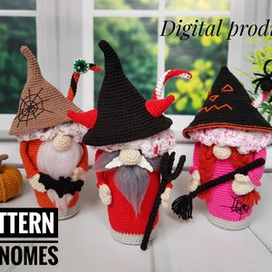 May include: Crocheted Halloween gnomes in orange, red, and pink with black hats. One gnome has a spiderweb design, another has devil horns, and the third has a witch hat. A small crocheted pumpkin is also visible. The text "PATTERN 3 GNOMES" is at the bottom.