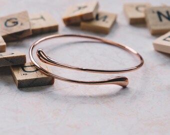 Rose Gold Plated Teardrop Bangle by Philip Jones