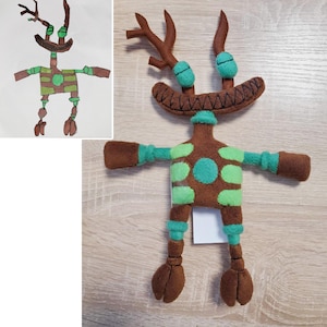 May include: A brown and green plush toy with antlers, a toothy grin, and a spotted body. The toy is based on a child's drawing of a creature.