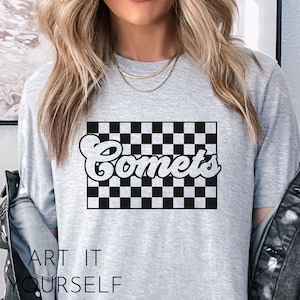 May include: Gray t-shirt with a black and white checkered design and the word "Comets" in a retro font.