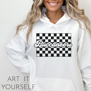 May include: White hoodie with a black and white checkered design and the word "Buccaneers" in a retro font.