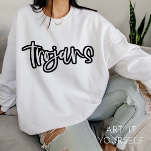 May include: White sweatshirt with black script lettering that says "Trojans".