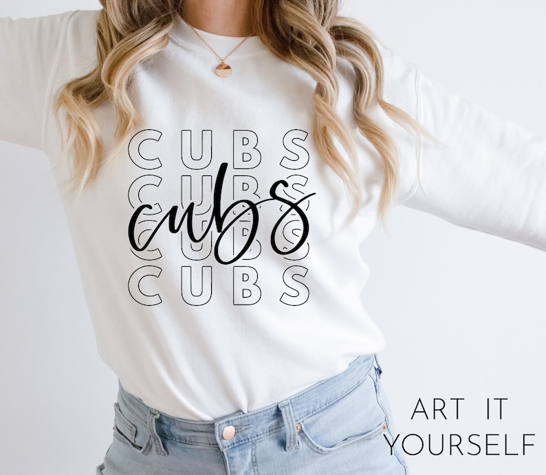 May include: White sweatshirt with the word "CUBS" repeated in a stacked design. The word "cubs" is also written in a cursive font over the stacked text. The phrase "ART IT YOURSELF" is printed in the bottom right corner.