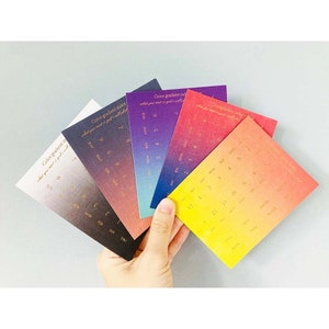 May include: Set of six colorful gradient index cards with gold foil lettering. Each card features a different color gradient and a calendar layout with months and numbers. The text on the cards reads "Color gradient index what you must is god's will".