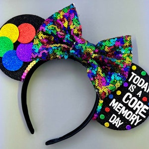 May include: Black mouse ears with a rainbow sequin bow and a black ear with colorful polka dots and the text "Today is a Core Memory Day".