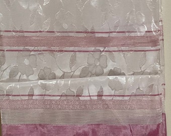 May include: White sheer curtain panel with a floral pattern and pink stripes. The bottom of the curtain is a solid pink with a floral pattern.
