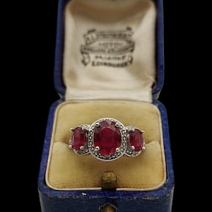 Beautiful Modern Skillfully Crafted Decorative Statement Design Sparkling Trilogy Synthetic Ruby Sterling Silver Ring - size M / 6.25