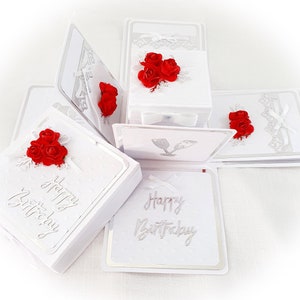 May include: White explosion box card with red roses and the text "Happy Birthday" on the front.