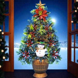 May include: A decorative Christmas tree with a snowman, holly, and berries. The tree is topped with a gold star and red poinsettia, with "Merry Christmas" written on it. It's set in a wooden barrel base, against a snowy winter backdrop.