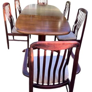 Vintage dining table extendable table with Danish designer dining table with six upholsterd dining chairs
