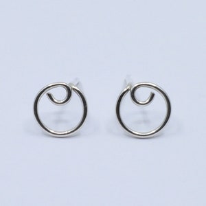 Round sterling silver studs with small curve detail. Silver earrings, handmade, silver jewellery, subtle earrings, dainty studs