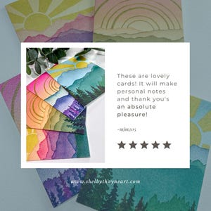 May include: A collection of square greeting cards featuring watercolour landscape illustrations of suns, mountains, and forests in gradients of yellow, pink, purple, blue, and green. The text reads: These are lovely cards! It will make personal notes and thank you's an absolute pleasure! -mjm205