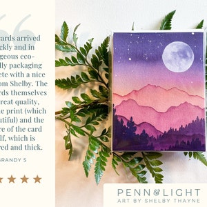 May include: A rectangular greeting card featuring a watercolour illustration of a mountain range at night under a full moon. The scene transitions from a dark purple sky with stars to pink and purple layered mountains and dark purple pine trees.