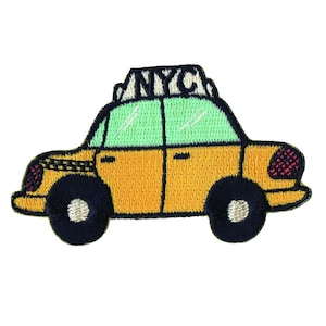May include: Embroidered patch of a yellow New York City taxi cab with black wheels and a green roof. The word "NYC" is embroidered on the roof. The patch has a detailed, textured appearance.
