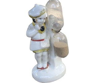 Antique Porcelain Figural Boy on Phone with Egg Timer