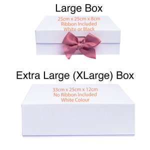May include: Two white gift boxes with lids. The smaller box is 25cm x 25cm x 8cm and includes a ribbon in white or black. The larger box is 33cm x 25cm x 12cm and does not include a ribbon. Both boxes are white.