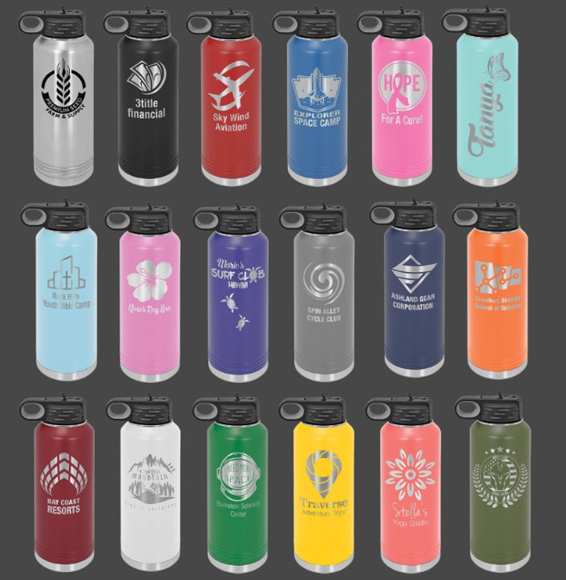 May include: Twenty stainless steel water bottles with various colors and designs. Each bottle has a black lid with a carrying handle. The bottles feature a variety of engraved designs, including logos, text, and images.