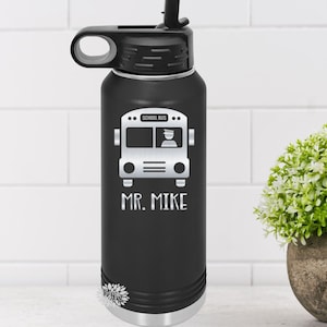 May include: Black stainless steel water bottle with a silver school bus graphic and the text "SCHOOL BUS" and "MR. MIKE".