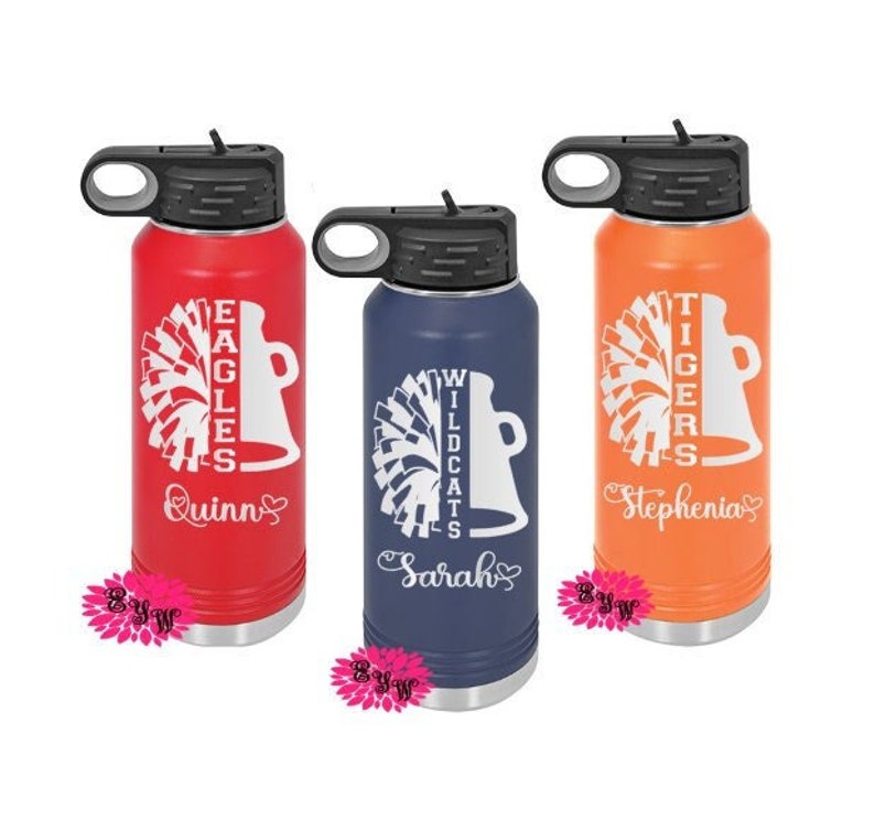 May include: Three personalized stainless steel water bottles with different team names and cheerleading pom-poms. The bottles are red, blue, and orange with white lettering. The names on the bottles are Quinn, Sarah, and Stephenia.