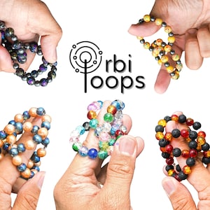 Brinquedo antiestresse que se ajusta perfeitamente à ponta dos dedos, uma pequena maravilha que proporciona satisfação | Orbi Loops - Brinquedo sensorial pessoal para prazer sensorial, um presente que encanta ao toque