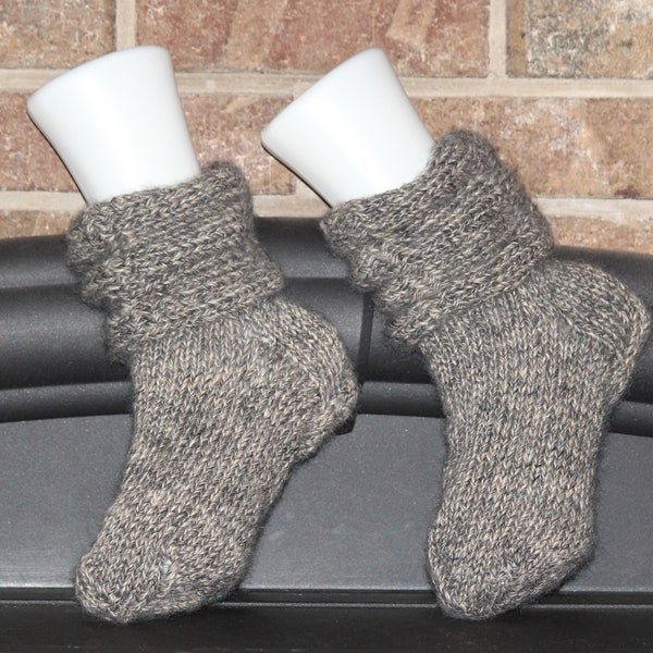 Grey wool socks hand-knitted from self-striping yarn; very comfortable silky feel; thing enough to be worn inside boots/sneakers