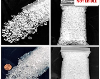 May include: Four images showcasing clear, decorative filler. One image shows clear, round beads spilling from a bag. The other images show clear, square-shaped beads in bags. The text "NOT EDIBLE" is visible in one image.