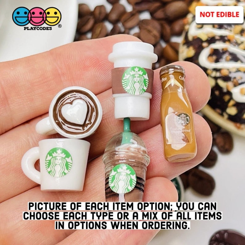 May include: A set of miniature Starbucks-themed coffee cups and a bottle of iced coffee. The cups are white with a green Starbucks logo and a brown lid. The bottle is clear with a brown liquid and a green Starbucks logo. The items are not edible and are for decorative purposes only.