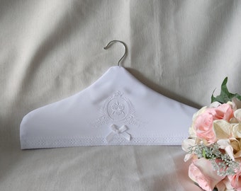 Embroidered white coat hanger cover