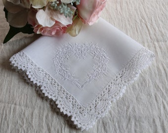 White handkerchief embroidered with white roses