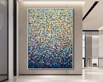 May include: Abstract painting with a white background and a gradient of blue, yellow, and red paint. The painting is made up of small, colorful dots and dashes.